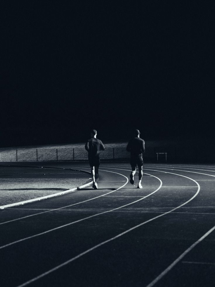 Athletes running at night